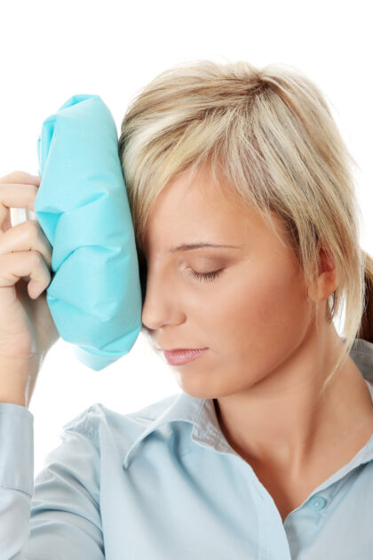 Woman applies Cold compress  to cheek and orbit