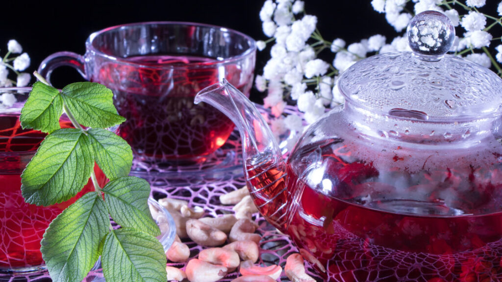 Red hot hibiscus tea in glass mug. Tea time: cup of tea, carcade