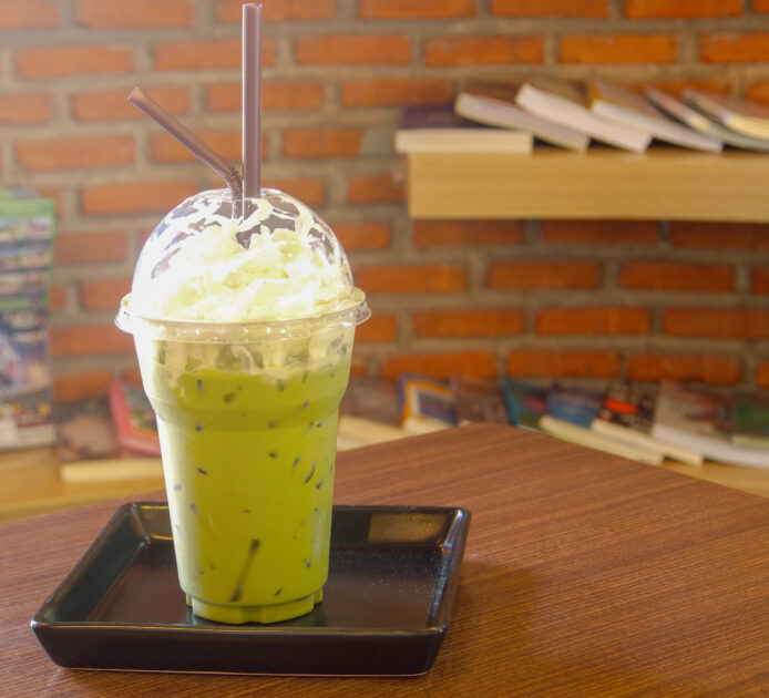 green tea smoothies with cream in cafe
