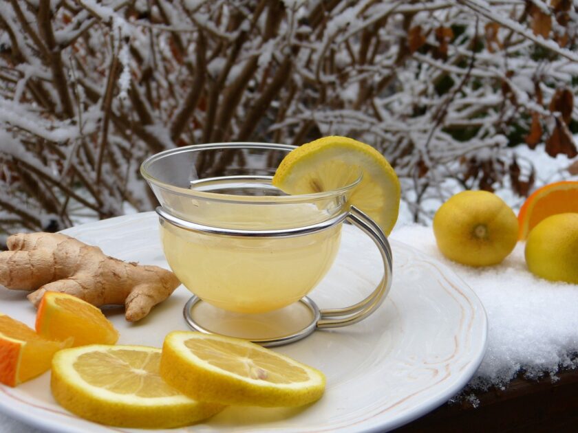 Ginger hot lemon tea in glass cup