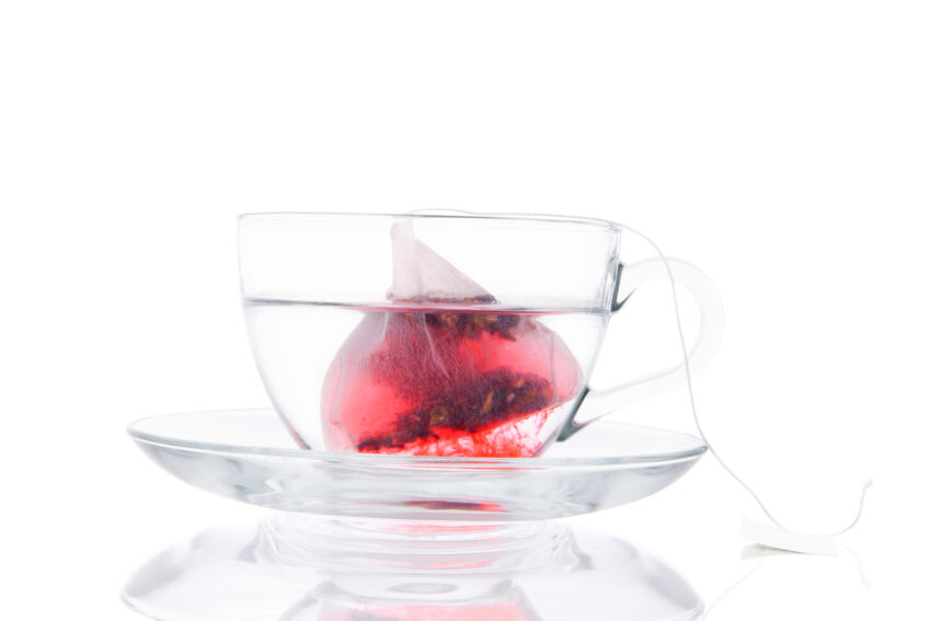 Tea Bag In The Transparent Cup With Water