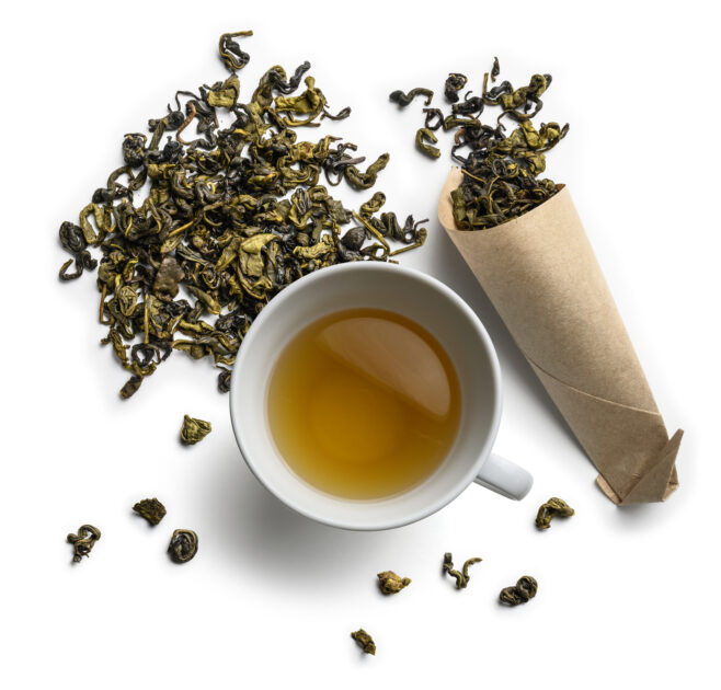 Green tea and a Cup of tea on a white background