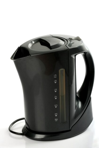 Modern black electric kettle on a white backrgound