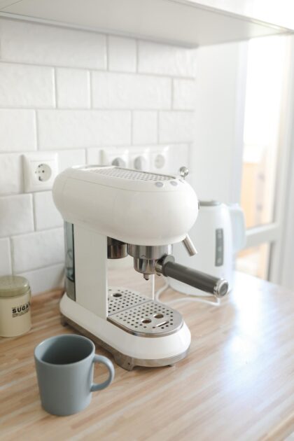 White coffee machine in home interior in the morning