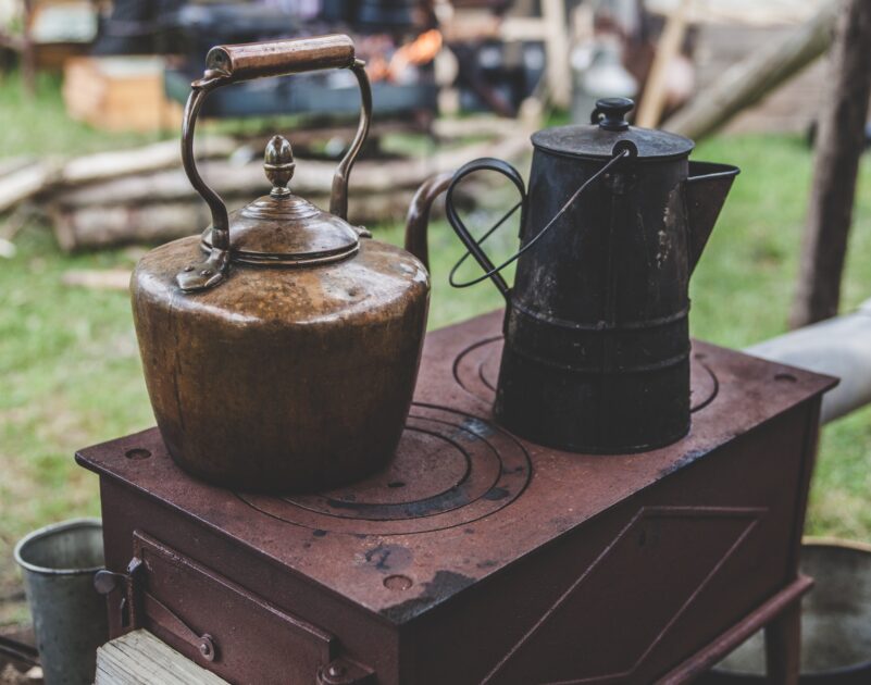 Rustic stovetop with antique tea kettle