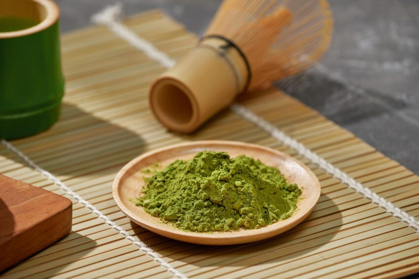 Organic Green Matcha Tea on wooden table. 